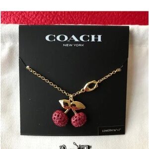 Coach Gold Necklace with Red Cherry Pendant